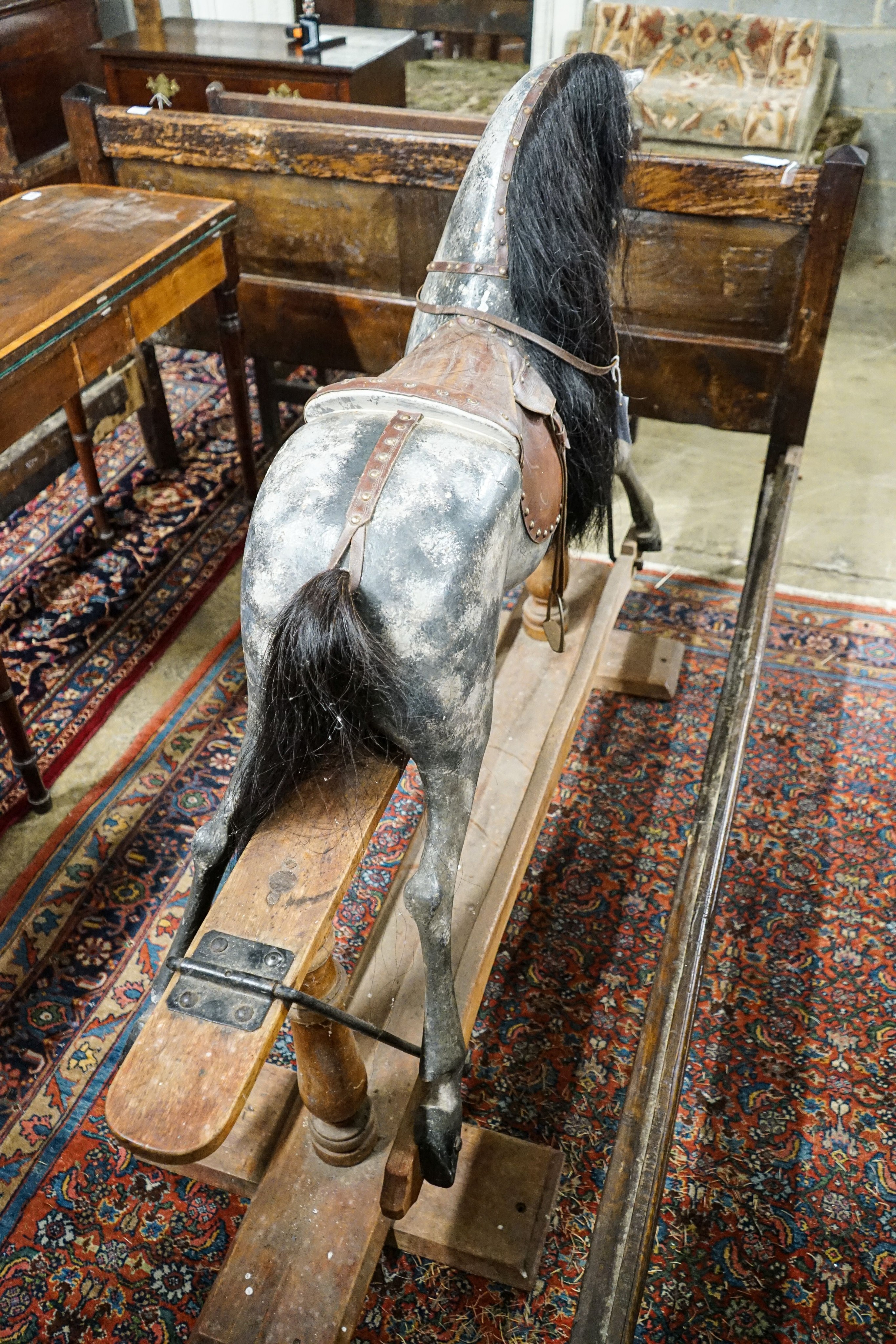 A large Edwardian Ayres type rocking horse on a turned safety frame, length 160cm, height 110cm